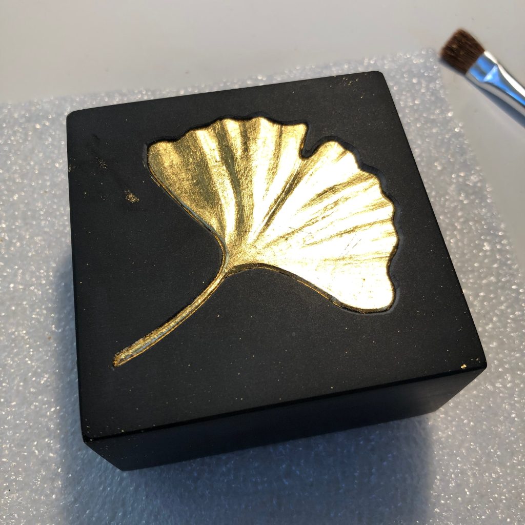 Gilded ginko leaf in slate.